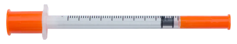 A real insulin syringe with orange caps on both ends.